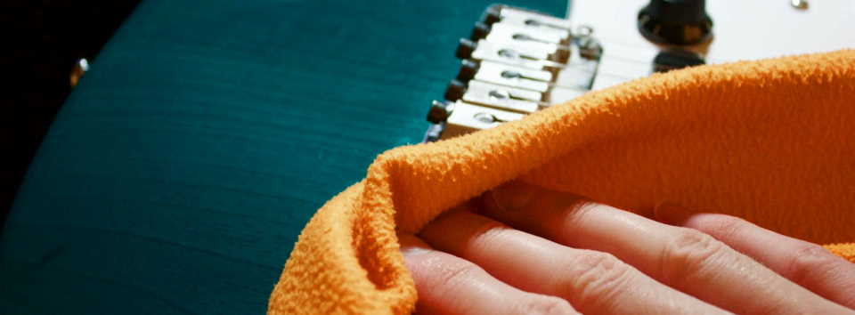 removing the dirt of the fretboard